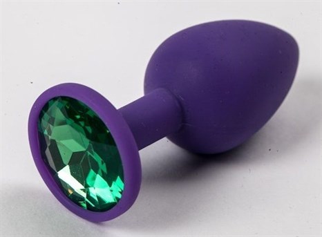 Фиолетовая силиконовая анальная пробка с зеленым стразом - 7,1 см. - фото 394633