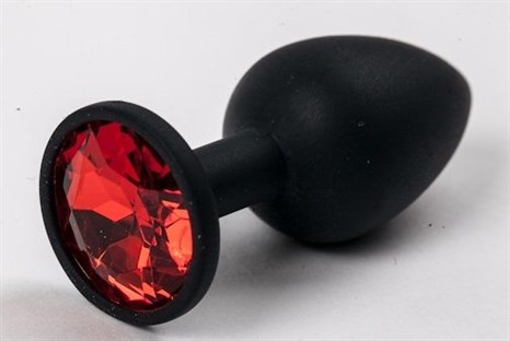 Черная силиконовая анальная пробка с красным стразом - 7,1 см. - фото 394641