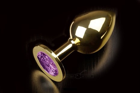 Большая золотая анальная пробка с закругленным кончиком и фиолетовым кристаллом - 9 см. - фото 395959